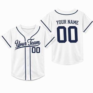 May include: White baseball jersey with navy blue trim and lettering. The front of the jersey reads "Your Team" and the number "00". The back of the jersey reads "YOUR NAME" and the number "00".
