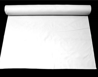 May include: A white roll of fabric, unfurled and lying flat on a black background.