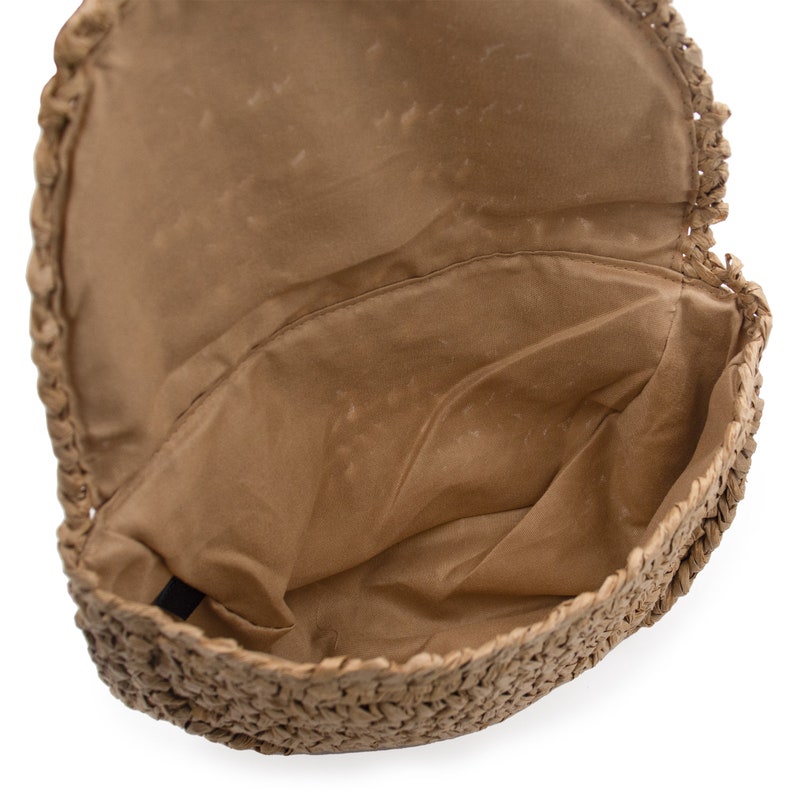 Inside of beige straw fanny pack
