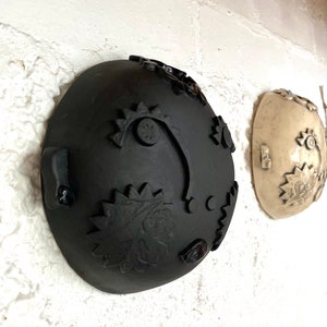 Beautiful handmade black ceramic wall-hung face vase
