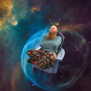 May include: A man with a beard sits in a blue and gray chair, wearing a green shirt and brown and gold patterned pants. He is floating in space against a backdrop of a nebula.