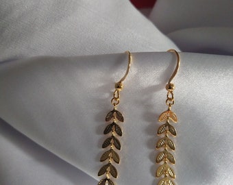 Beautiful and delicate long golden earrings