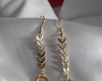 Beautiful and delicate long golden earrings