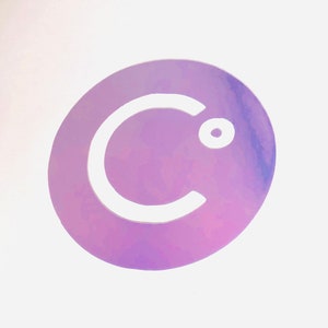 May include: A white letter "C" with a small circle in the top right corner, on a purple and pink iridescent background.