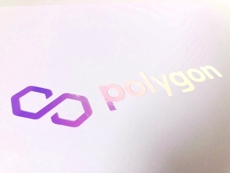 May include: A purple infinity symbol with a white background and the word "polygon" in white text.