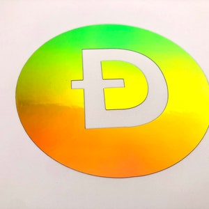 Puede incluir: Una pegatina redonda con un degradado de verde, amarillo y naranja. La pegatina tiene una letra "D" blanca con una barra transversal en el centro.