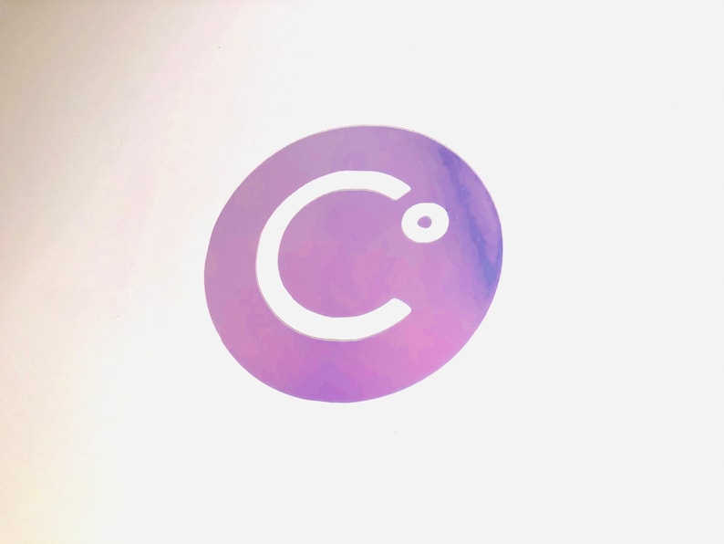 May include: A white letter "C" with a small circle in the top right corner, on a purple and pink iridescent background.