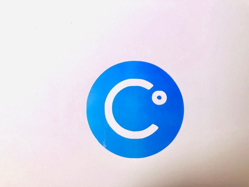 May include: A blue circle with a white letter "C" and a white dot inside the circle.