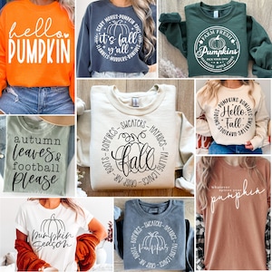 Könnte beinhalten: Eine Kollektion von Herbstbekleidung, darunter Sweatshirts und T-Shirts. Designs mit Kürbisgrafiken und Sätzen wie "Hello Pumpkin", "It's Fall y'all" und "Pumpkin Season". Farben sind Orange, Marine, Grün und Beige.