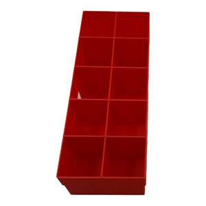 May include: A red plastic storage organizer with twelve compartments. The organizer is empty.