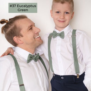 In the photo father and son in white shirts wearing the same model Eucalyptus green color linen bow ties and Eucalyptus green color linen adjustable suspenders with clips.