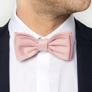The front-view model wears a blush pink color linen bow tie.