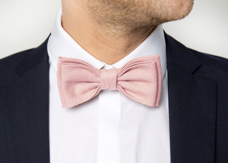 The front-view model wears a blush pink color linen bow tie.