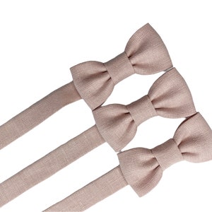 dusty pink bow tie and suspenders