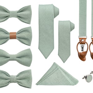 Light Sage green color linen bow ties in various styles, wrapped neckties, the same color cufflinks with light sage green color linen detail in the middle, folded pocket square, universal suspenders with leather for buttons and clips.