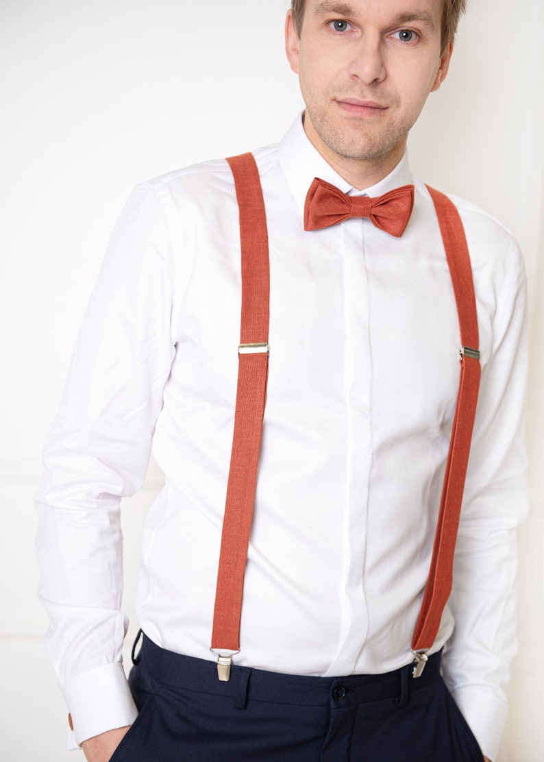 The front-view model wears the same aurora red color linen bow tie, cufflinks, and aurora red color linen suspenders with clips.