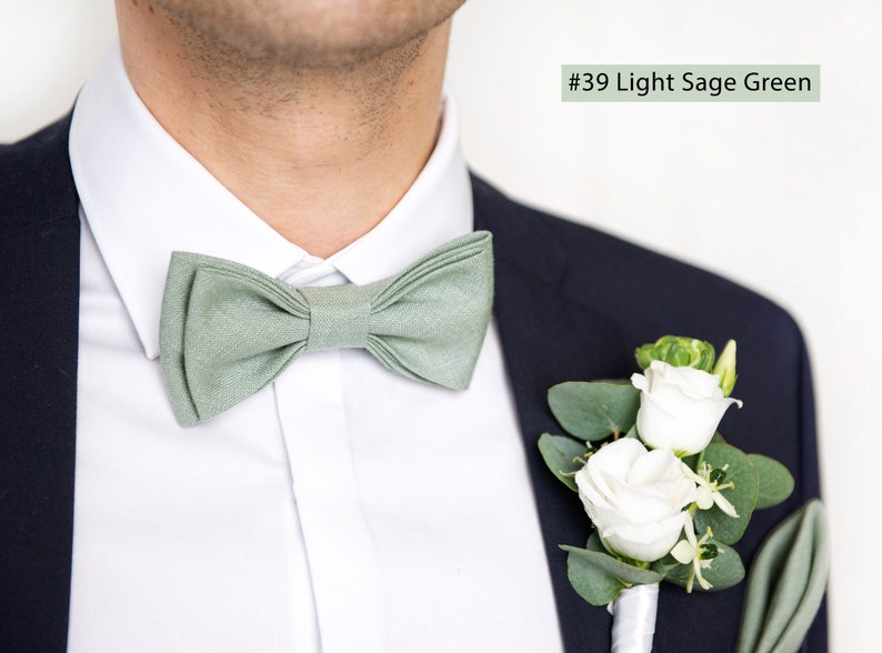The front-view model wears a light sage green color linen bow tie and pocket square.