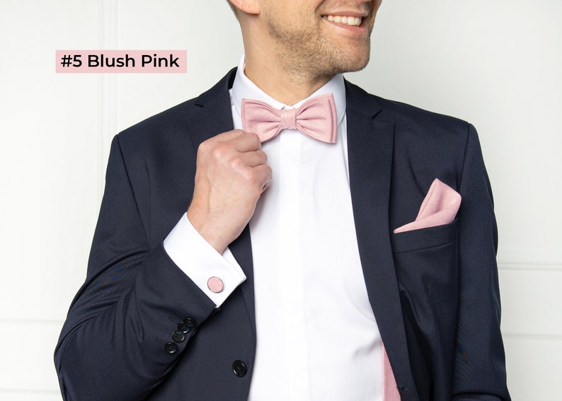 The front-view model wears a blush pink color linen bow tie, cufflinks, pocket square, and blush pink color linen suspenders.