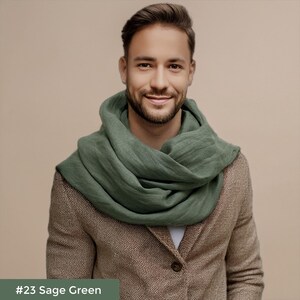 May include: A man wearing a sage green scarf over a brown tweed jacket. #23 Sage Green