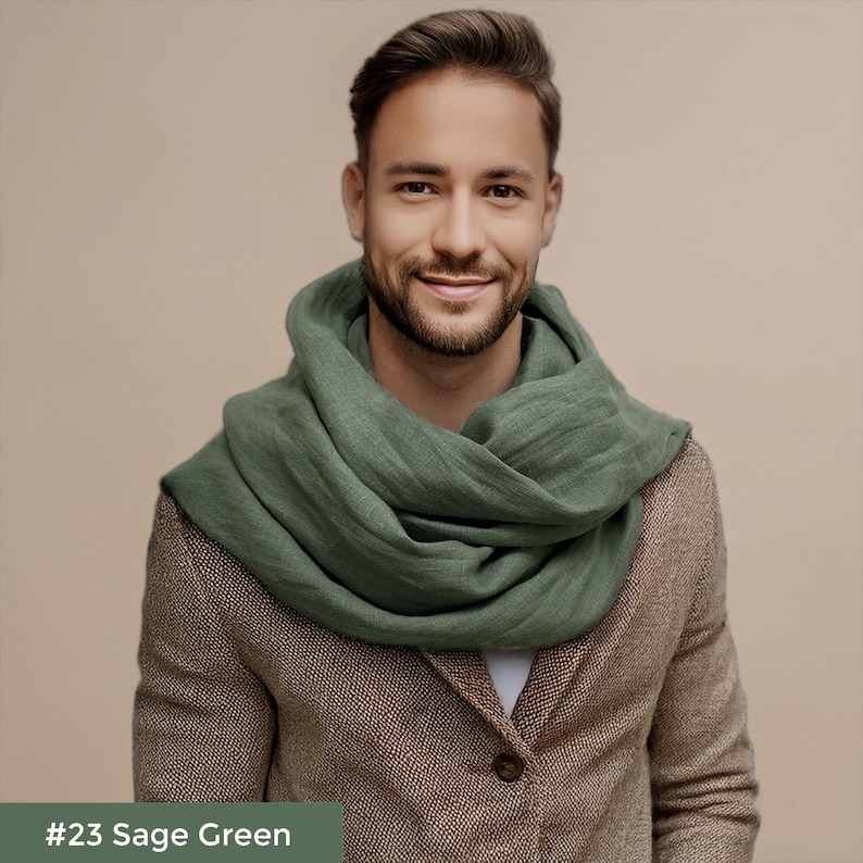 May include: A man wearing a sage green scarf over a brown tweed jacket. #23 Sage Green