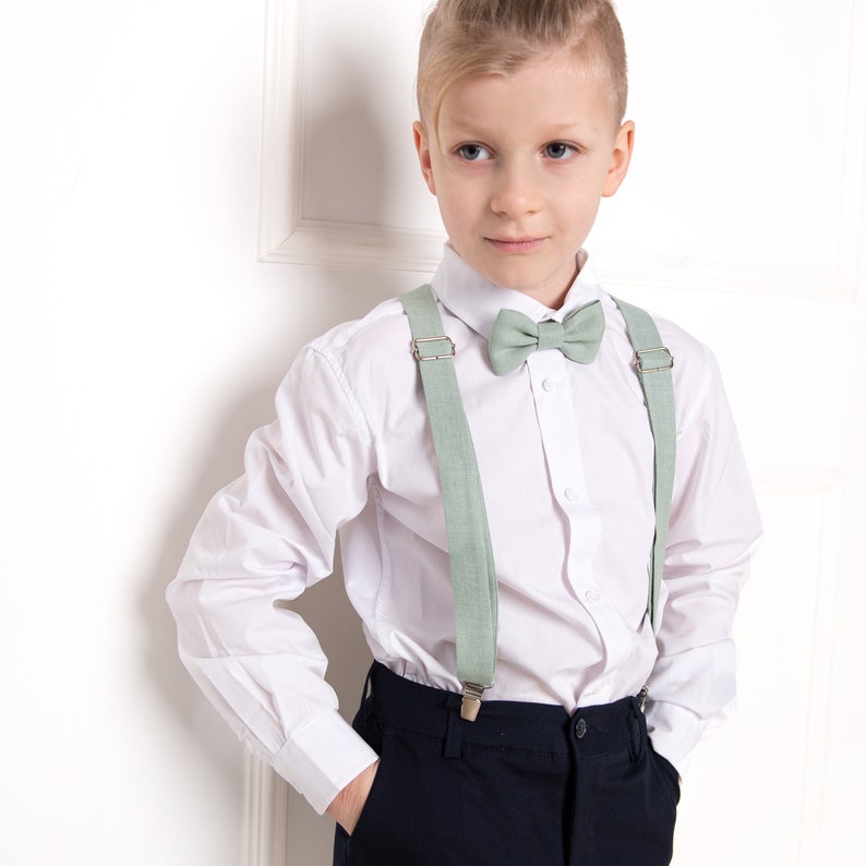 A child with a light sage green color bow tie and suspenders for any occasion: Wedding, Birthday, Baptism, Christening, Gift, and others.