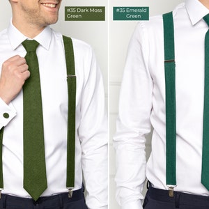 The groomsmen wear dark moss-green and emerald-colored linen neckties and suspenders.