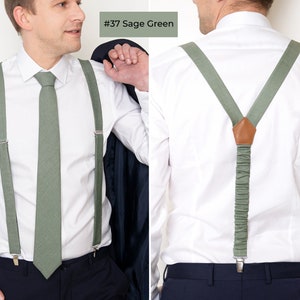 The front-view model wears the Sage green color linen Regular-size necktie and suspenders with clips. On the right, the model from the back wears the same sage green color linen Y-type suspenders with clips.