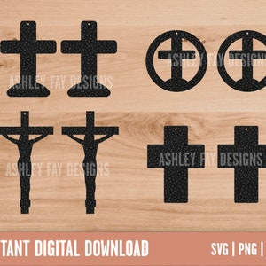 May include: A collection of black cross-shaped earrings in various designs, including a cross within a circle and a crucifix. The earrings have a textured surface and are displayed on a light brown wooden background. The text "ASHLEY FAY DESIGNS" is visible on some earrings. The words "INSTANT DIGITAL DOWNLOAD" are at the bottom.
