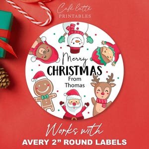 May include: A circular Christmas label featuring festive cartoon characters like a snowman, reindeer, and Santa Claus. The label says "Merry Christmas From Thomas" and is decorated with red and green dots. Designed for Avery 5 cm round labels.