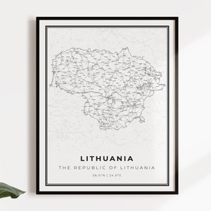 May include: A black and white map of Lithuania, showing the country's roads and cities. The map is framed in a black frame and has the text "Lithuania, The Republic of Lithuania, 56.0°N | 24.0°E" printed below the map.