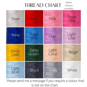May include: Thread chart with color swatches for embroidery floss. Colors include silver, red, pink, deep pink, navy, royal blue, lilac, light lilac, deep gold, deep green, light coral, beige, light blue, black, grey, and white.  +More Colors Available.