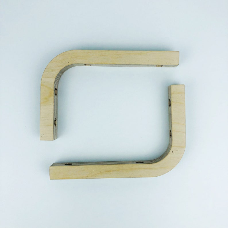 May include: Two unfinished wooden corner brackets, each with four pre-drilled holes for mounting.