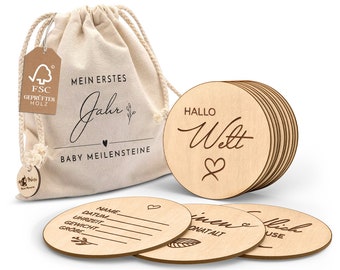 Wooden baby milestone cards in German - 30 milestones on elegant wooden discs as a birth gift for pregnant women and expectant mothers.