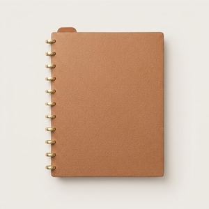 May include: A tan notebook with a textured cover and a gold-colored metal disc-bound spine. The notebook features a small, matching tan tab extending from the top edge, providing a clean and structured appearance for organizing notes and documents.