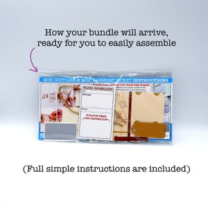 May include: A clear plastic bag containing a mini suitcase and passport ticket craft kit. The kit includes a small suitcase, a passport ticket, a tag, and instructions. The instructions include a message section, a "scratch here for destination" section, and a "please read before you start the ticket" section.
