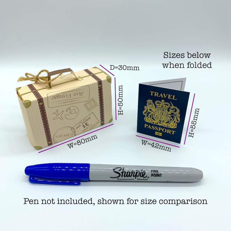 May include: A small, brown cardboard suitcase with a handle and a luggage tag that says "Bon Voyage". The suitcase is 3 inches wide, 5 inches tall, and 2 inches deep. A blue passport with the text "Travel Passport" is shown for size comparison.