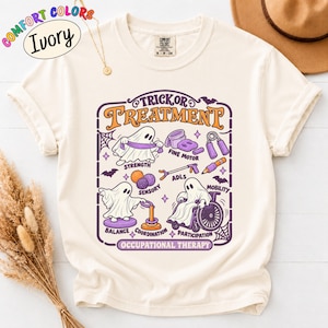 May include: An ivory t-shirt featuring a graphic with the text Trick or Treatment and Occupational Therapy. The design includes ghosts performing therapy activities like strength, fine motor, sensory, ADLs, mobility, balance, coordination, and participation.