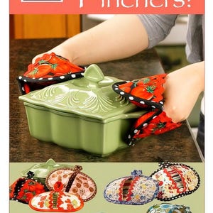 May include: The image shows a green casserole dish with a lid, held by red and black pot holders with a tomato design. The text "Pot Pinchers!" is displayed on a red background, along with the "Vanilla House designs" logo. Several pot holders with different patterns are also shown.