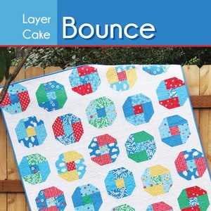 May include: A colorful quilt with octagonal blocks in red, blue, green, and yellow patterns on a white background. The word "Bounce" is displayed in large white letters. The text "Layer Cake" is above the word "Bounce". The text "Cluck Cluck Sew" is also visible.