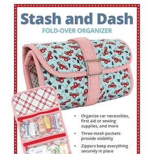 May include: A fold-over organizer with a light blue background and a pattern of red cars. The organizer has a pink strap and trim. The open interior reveals mesh pockets and supplies. Text on the image reads "Stash and Dash" and "byannie.com".