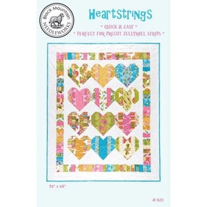 May include: Quilt pattern for a heart-shaped quilt with a white background and colorful hearts. The pattern is called "Heartstrings" and is quick and easy to make. It is perfect for using precut jellyroll strips. The quilt measures 56 inches by 68 inches.