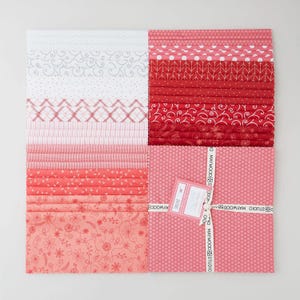 May include: A set of three ceramic mugs with a speckled, matte finish. The mugs are in shades of cream, light gray, and dark gray. Each mug has a simple, minimalist design, perfect for coffee or tea.