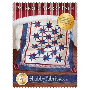 May include: A quilt titled Patriotic Starry Path featuring a red, white, and blue star pattern on a cream background. The border is dark blue with USA text and star motifs. A gold circular seal states it meets Quilts of Valor Foundation standards.