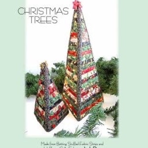 May include: Two Christmas tree patterns made from fabric scraps. The trees are green, red, and white with a star on top. The larger tree is 16 inches tall and the smaller tree is 8 inches tall. The pattern is called "Jingle Pops" and is copyright 2015. The pattern number is AT 276.