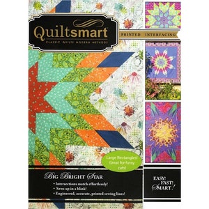 May include: Quiltsmart Big Bright Star quilt pattern featuring a colorful star design with printed interfacing. The pattern includes instructions for making a quilt with large rectangles, which are great for fussy cuts. The pattern is easy, fast, and smart.