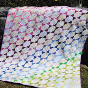 May include: A colorful quilt pattern with a diagonal design. The quilt is made up of triangles and squares in shades of pink, purple, blue, green, and white. The quilt is titled "Running with Scissors" and includes the text "All Rights Reserved, Copyright 2020 SJ #111".