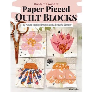 May include: A book cover with the title "Wonderful World of Paper Pieced Quilt Blocks" and a subtitle "30 Nature-Inspired Designs and a Beautiful Sampler". The cover features a pink background with a white title and a colourful quilt block design.