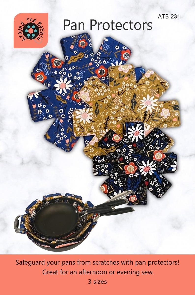 May include: Three floral patterned pan protectors in blue, mustard yellow, and black with white accents. The protectors are shaped like a star with eight points. The text "Pan Protectors" is in the upper center of the image. The text "ATB-231" is in the upper right corner of the image.
