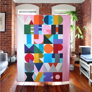 Bound Comapny Letra Quilt Pattern Finished size: 44” x 56”
