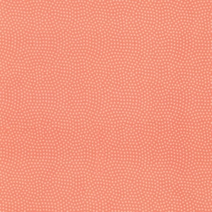 May include: A coral-coloured background with a repeating pattern of small, light peach dots. The dots are closely spaced, forming a textured design. This pattern is suitable for fabric, wallpaper, or other decorative applications. The design is uniform and consistent.